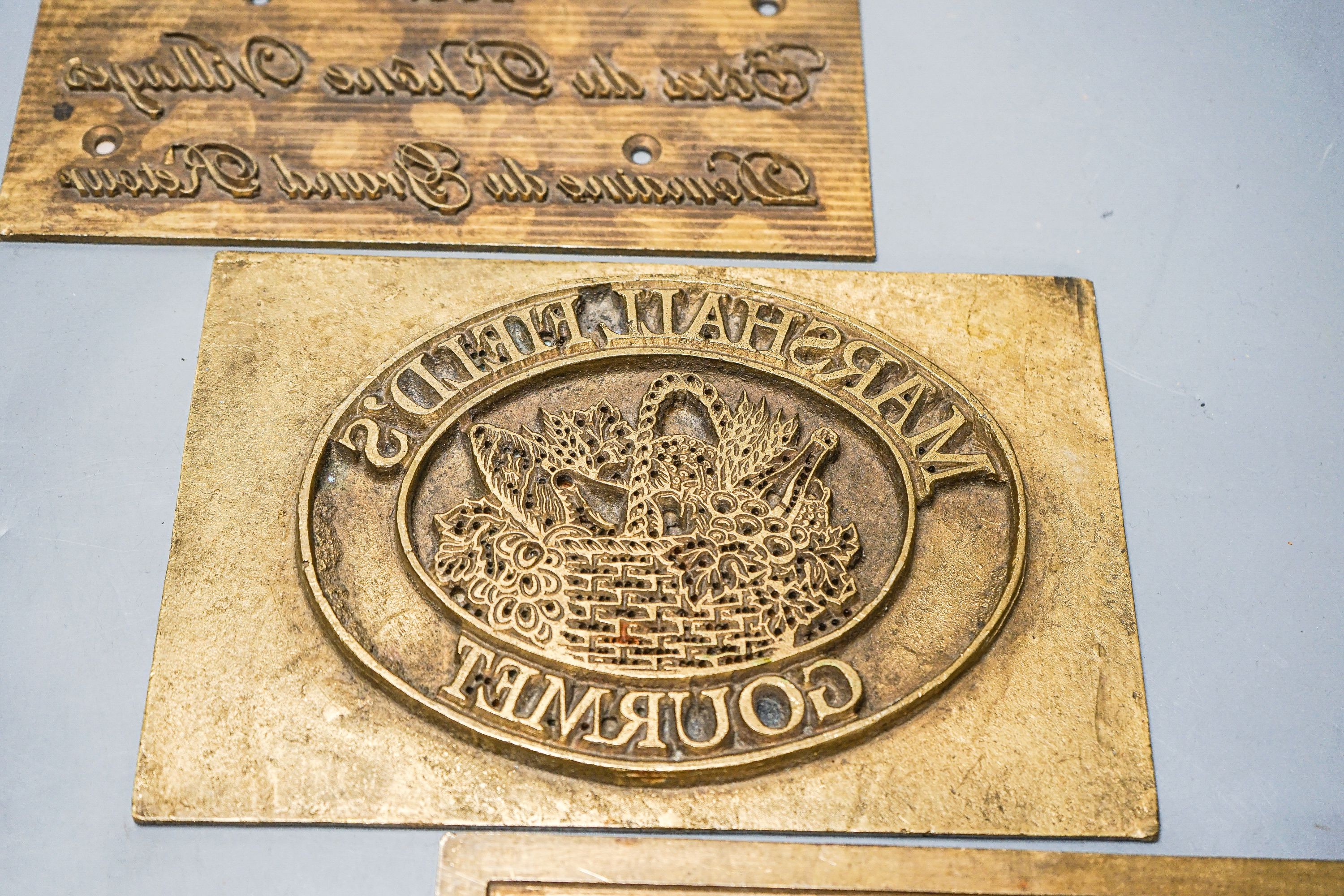 Three wine related brass printing plates